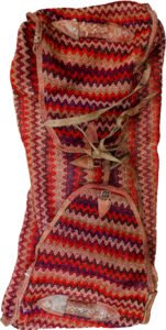 alt="Missoni-style tribal Rakhtekhab bag with leather straps and zigzag pattern" alt="Vintage Mafrash bag in red, green, yellow, and orange with full leather trim" alt="Nomadic woven storage bag suitable for ottoman or table conversion" alt="Colorful tribal bedding bag with intact leather handles and zigzag motif"