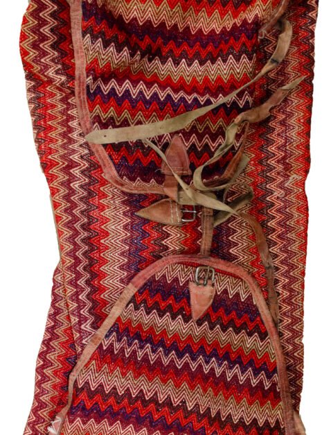 alt="Missoni-style tribal Rakhtekhab bag with leather straps and zigzag pattern" alt="Vintage Mafrash bag in red, green, yellow, and orange with full leather trim" alt="Nomadic woven storage bag suitable for ottoman or table conversion" alt="Colorful tribal bedding bag with intact leather handles and zigzag motif"