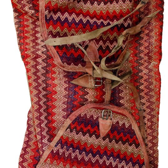 alt="Missoni-style tribal Rakhtekhab bag with leather straps and zigzag pattern" alt="Vintage Mafrash bag in red, green, yellow, and orange with full leather trim" alt="Nomadic woven storage bag suitable for ottoman or table conversion" alt="Colorful tribal bedding bag with intact leather handles and zigzag motif"