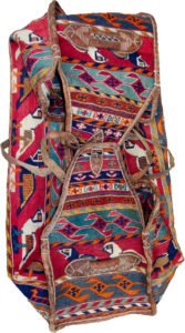 alt="Qashqai Rakhtekhab bag with sumak weave, partridges, goats, and leather trim" alt="Vintage tribal Mafrash bag in turquoise, red, blue, and orange with intact handles" alt="Sumak-woven nomadic bedding bag with animal motifs and collector value" alt="Traditional Qashqai storage bag repurposable as ottoman or table base"