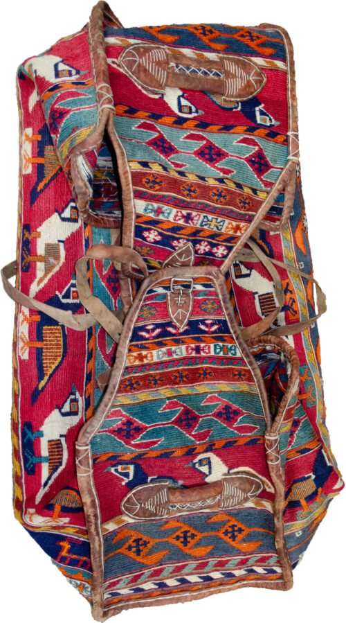 alt="Qashqai Rakhtekhab bag with sumak weave, partridges, goats, and leather trim" alt="Vintage tribal Mafrash bag in turquoise, red, blue, and orange with intact handles" alt="Sumak-woven nomadic bedding bag with animal motifs and collector value" alt="Traditional Qashqai storage bag repurposable as ottoman or table base"