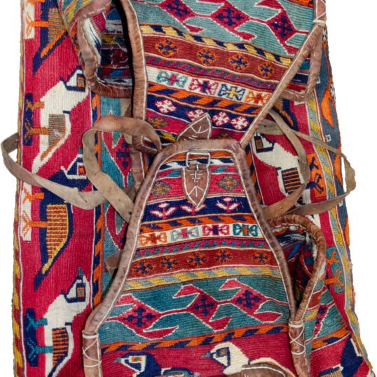 alt="Qashqai Rakhtekhab bag with sumak weave, partridges, goats, and leather trim" alt="Vintage tribal Mafrash bag in turquoise, red, blue, and orange with intact handles" alt="Sumak-woven nomadic bedding bag with animal motifs and collector value" alt="Traditional Qashqai storage bag repurposable as ottoman or table base"