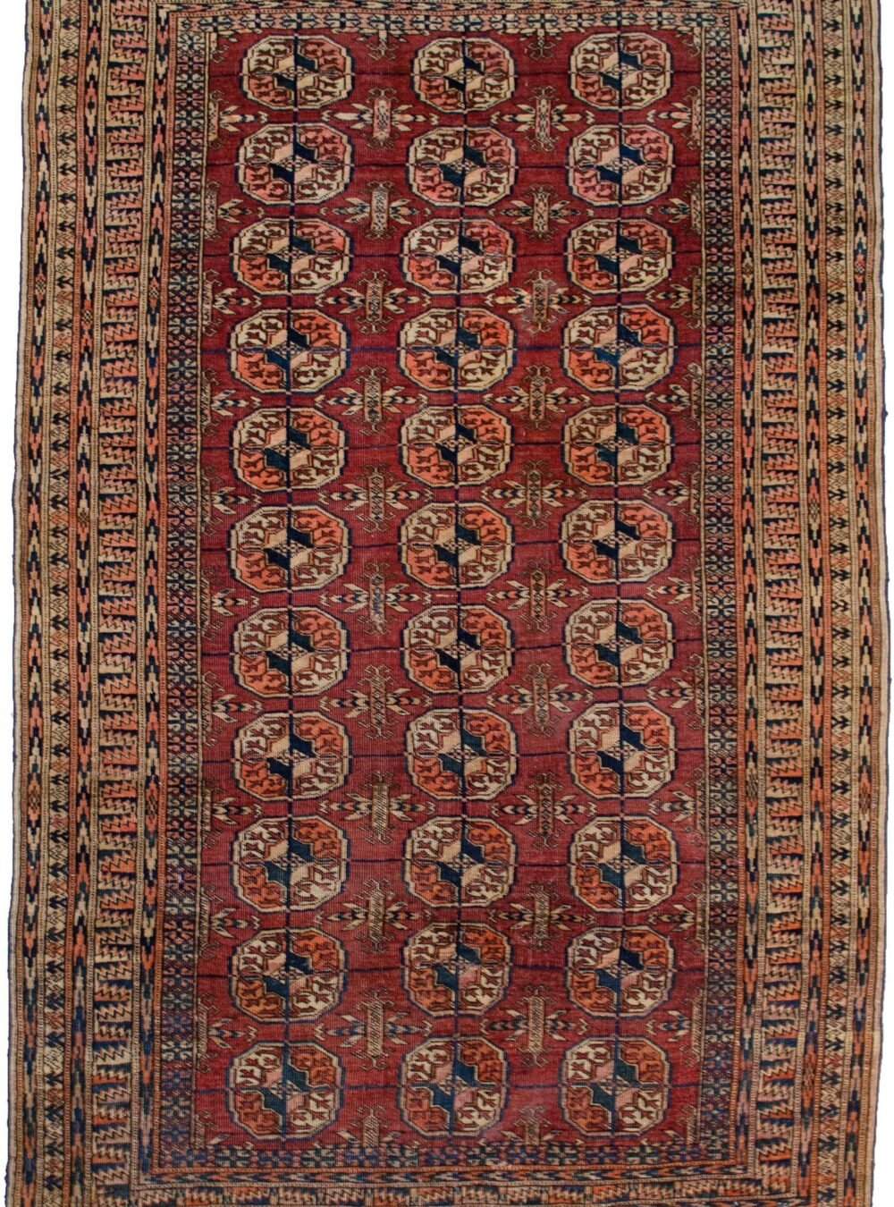 alt="Antique Turkmen rug with elephant foot motif and rust field" alt="Tribal rug with two-tone background and geometric borders" alt="Vintage Turkmen carpet in good condition with low pile" alt="Central Asian rug with elephant foot guls and traditional design"