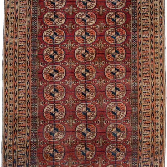 alt="Antique Turkmen rug with elephant foot motif and rust field" alt="Tribal rug with two-tone background and geometric borders" alt="Vintage Turkmen carpet in good condition with low pile" alt="Central Asian rug with elephant foot guls and traditional design"