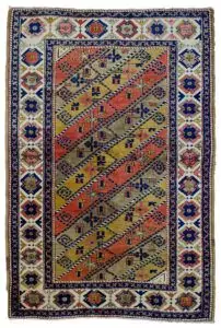 alt="Vintage Turkish rug with multicoloured diagonal floral design" alt="Turkish wool rug with cream border and stylised flowerheads" alt="Handwoven Turkish rug with diagonal stripe floral pattern" alt="Decorative Turkish carpet with high-quality wool and dyes"