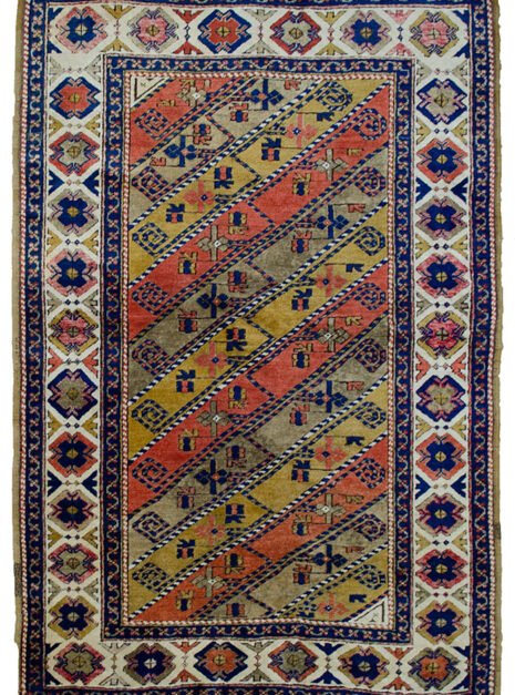 D13-Turkish-157x108cm.jpg alt="Vintage Turkish rug with multicoloured diagonal floral design" alt="Turkish wool rug with cream border and stylised flowerheads" alt="Handwoven Turkish rug with diagonal stripe floral pattern" alt="Decorative Turkish carpet with high-quality wool and dyes"