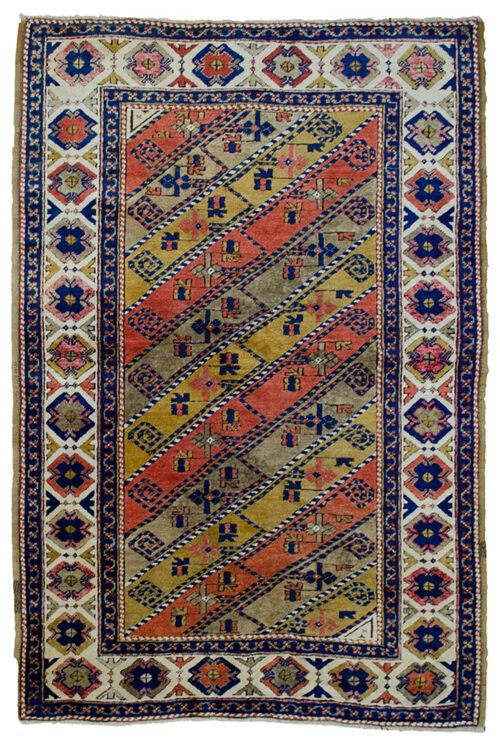 alt="Vintage Turkish rug with multicoloured diagonal floral design" alt="Turkish wool rug with cream border and stylised flowerheads" alt="Handwoven Turkish rug with diagonal stripe floral pattern" alt="Decorative Turkish carpet with high-quality wool and dyes"