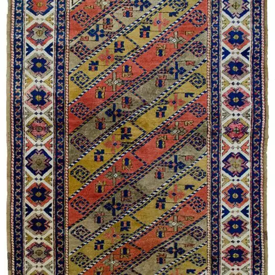 alt="Vintage Turkish rug with multicoloured diagonal floral design" alt="Turkish wool rug with cream border and stylised flowerheads" alt="Handwoven Turkish rug with diagonal stripe floral pattern" alt="Decorative Turkish carpet with high-quality wool and dyes"