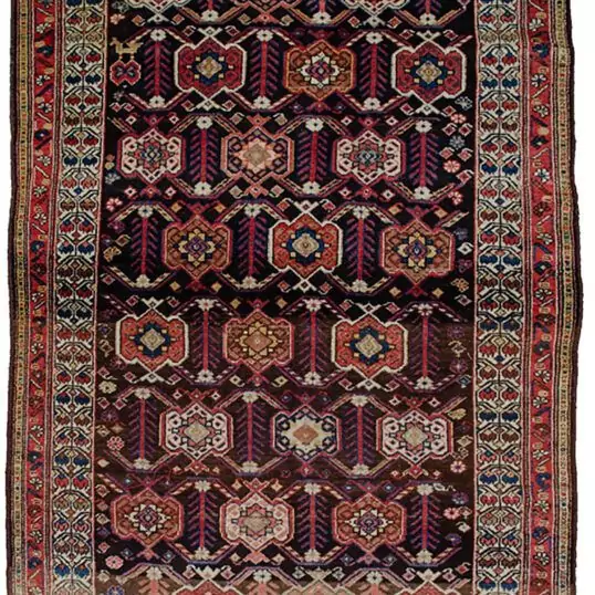 alt="Antique Shahsavan rug with cartouche and tulip border design" alt="Tribal Persian rug from Saveh with cypress and flower head motifs" alt="Navy-grey field Shahsavan rug with cream tulip border" alt="Abrash detail in antique Shahsavan carpet"
