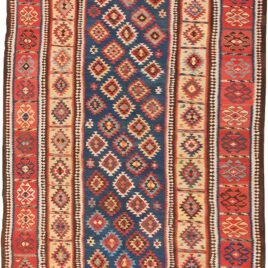 alt="Antique Shirvan kilim with blue ground and lozenge motifs" alt="Shirvan kilim with evil eye red border and yellow inner frame" alt="Caucasian flatweave with multicoloured lozenges and symbolic motifs" alt="Restored antique Shirvan kilim with tribal design and bold colours"
