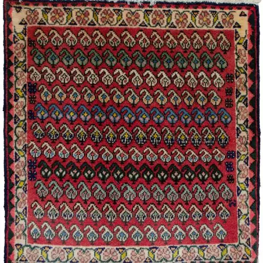 alt="Vintage Qashqai bag face with boteh motifs on red background" alt="Tribal Persian textile with cream floral border and paisley design" alt="Handwoven Qashqai bag face from South Iran" alt="Decorative vintage tribal bag face with boteh motifs"