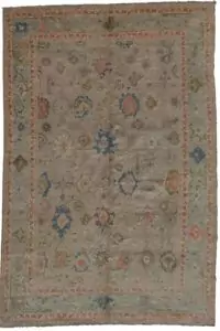 alt="Ushak carpet with taupe field and duck egg blue border" alt="Handwoven Ushak rug with Harchang floral design" alt="Modern production Ushak with antique finish and natural dyes" alt="Taupe and blue Persian-style rug with all-over floral motif"