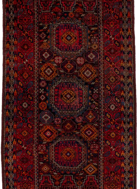 alt="Antique Baluch rug with elephant foot design and deep red tones" alt="Tribal Baluch rug with S motifs and multicoloured outer border" alt="Handwoven Baluch carpet with rare red hue and geometric centrepiece" alt="Collector’s Baluch rug featuring elephant foot and tribal patterns"