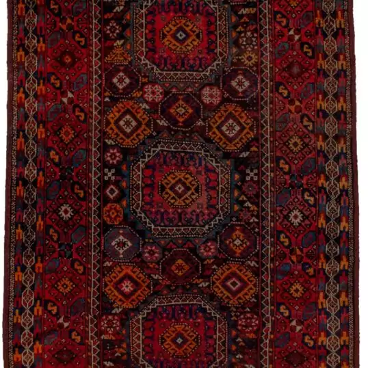 alt="Antique Baluch rug with elephant foot design and deep red tones" alt="Tribal Baluch rug with S motifs and multicoloured outer border" alt="Handwoven Baluch carpet with rare red hue and geometric centrepiece" alt="Collector’s Baluch rug featuring elephant foot and tribal patterns"