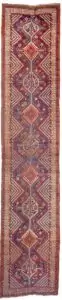 alt="Antique Khamseh runner with light blue ground and tribal motifs" alt="Persian tribal runner with birds, dogs, and medallions" alt="Rare Khamseh rug from South Iran with floral and animal motifs" alt="Vintage narrow Khamseh rug with central medallions on blue field"