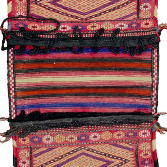 Vintage Kelat tribal bag with floral border Intact Khorjin bag from Northeast Iran Joyful colours on vintage Kelat weaving Fine weave detail of Kelat nomadic bag Decorative Persian tribal saddlebag