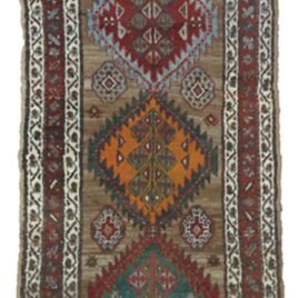 “Antique Kordi runner with grey-brown ground and red borders” “Persian tribal rug with medallion design and white guard borders” “Handwoven Kurdish runner with unique earthy colour palette” “Vintage Persian runner for hallway or corridor décor”