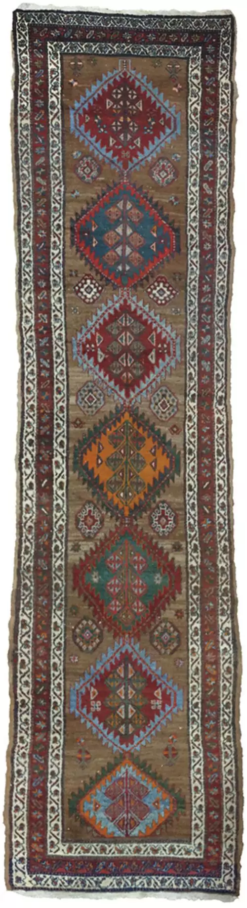 “Antique Kordi runner with grey-brown ground and red borders” “Persian tribal rug with medallion design and white guard borders” “Handwoven Kurdish runner with unique earthy colour palette” “Vintage Persian runner for hallway or corridor décor”