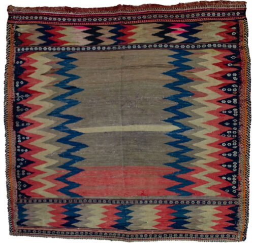 alt="Antique Afshar Sofreh kilim with zigzag design and floral motifs" alt="Handwoven grey-blue kilim from South Iran with tribal patterns" alt="Vintage Persian Sofreh used for dough with decorative zigzags" alt="Afshar tribal kilim with colourful zigzag bands and white flowers"