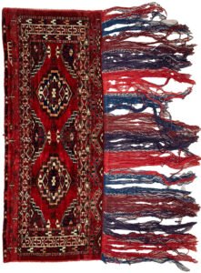 Vintage Turkmen Tobreh with deep red field Tasselled edge of antique Turkmen tribal bag Close-up of end motifs on Turkmen Tobreh Blood red wool Tobreh from Northeast Iran Collectible Turkmen nomadic storage bag