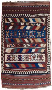 alt="Tribal kilim with bold central motifs and cream geometric border" alt="Handwoven wool kilim with multicoloured striped ends" alt="Decorative tribal kilim with traditional patterns and colourful finish" alt="Flatweave kilim with tribal design and balanced layout"