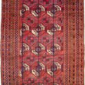 alt="Vintage Turkmen rug with octagonal guls and ram’s horn motifs" alt="Tribal rug with olive green borders and geometric field design" alt="Three-row Turkmen carpet with symbolic motifs and earthy tones" alt="Handwoven Turkmen rug in good vintage condition with soft colours"