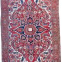 alt="Gharadagh Heriz carpet with red ground and bold medallion" alt="Vintage Persian rug with Samavar border and white spandrels" alt="Large Heriz rug with stylised floral design from Northwest Iran" alt="Restored antique Heriz carpet with bold colours and classic motifs"