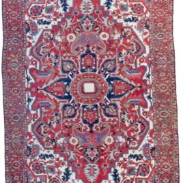 alt="Gharadagh Heriz carpet with red ground and bold medallion" alt="Vintage Persian rug with Samavar border and white spandrels" alt="Large Heriz rug with stylised floral design from Northwest Iran" alt="Restored antique Heriz carpet with bold colours and classic motifs"