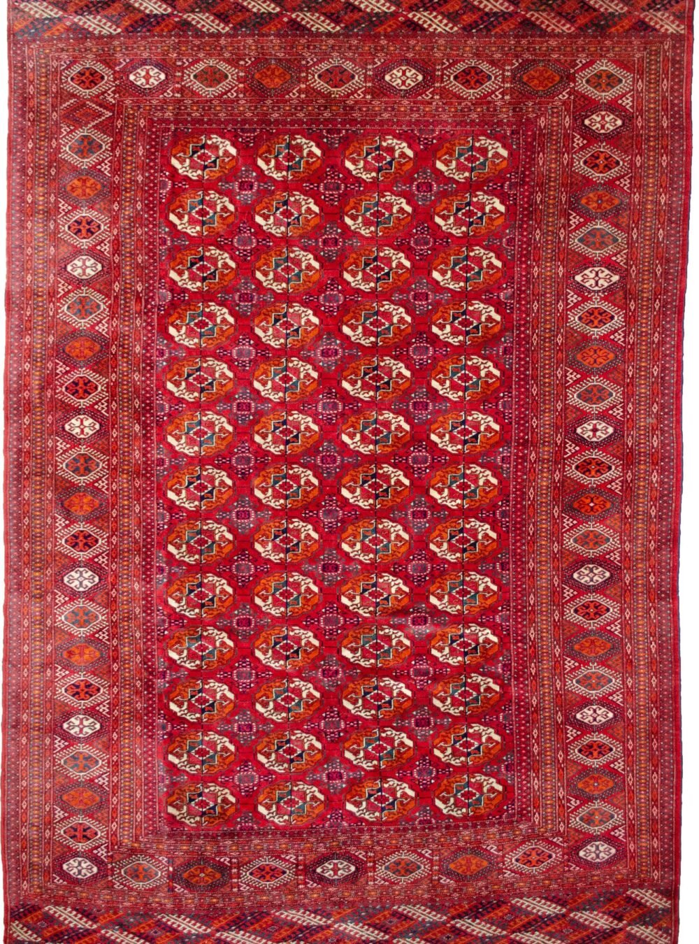 alt="Fine Turkmen carpet with Tekke Gul motif in excellent condition" alt="Masterwoven Gushly Gul rug with sharp design details" alt="Tribal Turkmen rug featuring traditional Tekke symbols" alt="Red field Turkmen carpet with crisp geometric gul design"