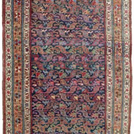 “Antique Bijar runner with blue field and apricot floral border” “Handwoven Persian rug with low pile and wool foundation” “Elegant narrow Bijar rug for hallway or corridor” “Densely woven antique Bijar runner from West Iran”
