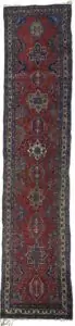 “Antique Heriz runner with deep red field and medallions” “Northwest Persian Heriz carpet with cream geometric border” “Hand-knotted antique runner with traditional Heriz design” “Vintage Heriz hallway rug from Iran with natural dye colours”