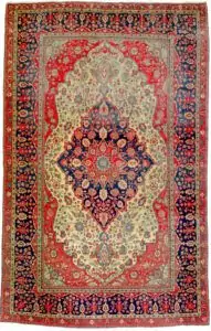 alt="Antique Mohtasham Kashan rug with jewel-toned colours and fine weave" alt="Persian Kashan carpet with velvety wool and natural dyes" alt="Mohtasham Kashan rug with even wear and historic charm" alt="Fine Persian carpet with classical design and reduced end"