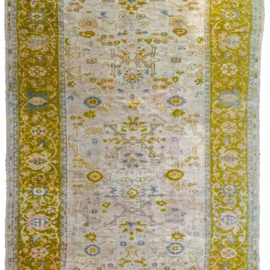 alt="Rare antique Ziegler Sultanabad carpet with olive green border" alt="Large cream-ground Persian rug with all-over floral design" alt="Decorative antique Sultanabad rug with light blue and peach accents" alt="Age-worn Ziegler carpet from Central Iran with Western market size"