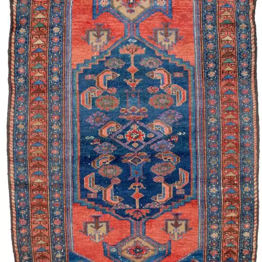alt="Antique Zanjan rug with deep red hue and bold design" alt="Persian tribal rug with geometric motifs from Northwest Iran" alt="Vintage handspun wool rug with natural sheen" alt="Zanjan rug with strong character and rich colours"