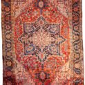 alt="Heriz carpet with bold medallion and terracotta red ground" alt="Persian rug with white spandrels and geometric design" alt="Classic Heriz rug with flowing border and good pile" alt="Antique Heriz carpet with minor wear and strong colours"