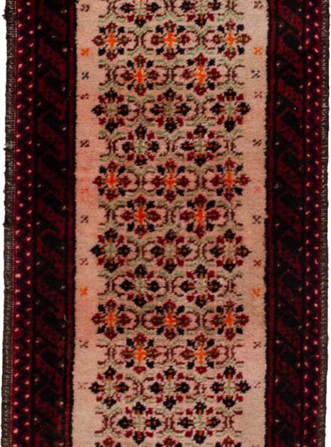 alt="Narrow Baluch runner with light pink floral field" alt="Vintage hallway runner with stylised flowers and red borders" alt="Slim Baluch tribal rug with pink ground and geometric edges" alt="Rare format Persian runner for narrow hallway space"