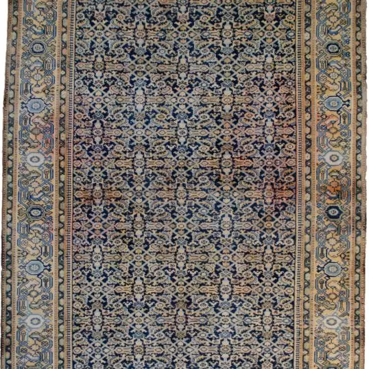 alt="Antique Cheshme rug with blue Herati design and rose border" alt="Persian Farahan rug with subtle abrash and geometric pattern" alt="Low-pile antique rug from Iran with classic Herati motif" alt="Elegant vintage Persian rug with blue field and rose-toned border"