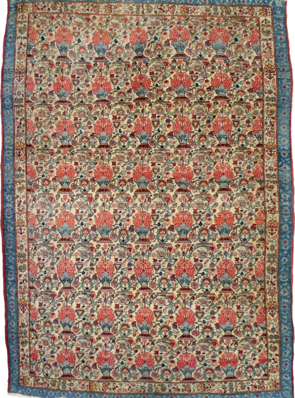 alt="Antique Qum rug with cream field and vase floral design" alt="Persian rug with narrow paisley and three-tone floral border" alt="Elegant Qum carpet with vases of flowers and light blue accents" alt="Unusual antique Persian rug with floral motif and narrow borders"