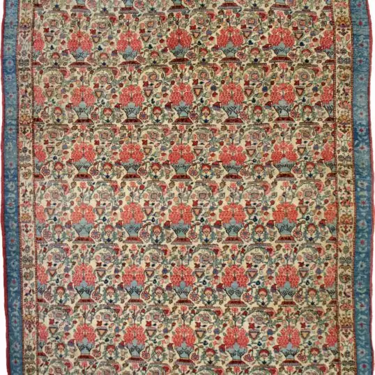 alt="Antique Qum rug with cream field and vase floral design" alt="Persian rug with narrow paisley and three-tone floral border" alt="Elegant Qum carpet with vases of flowers and light blue accents" alt="Unusual antique Persian rug with floral motif and narrow borders"