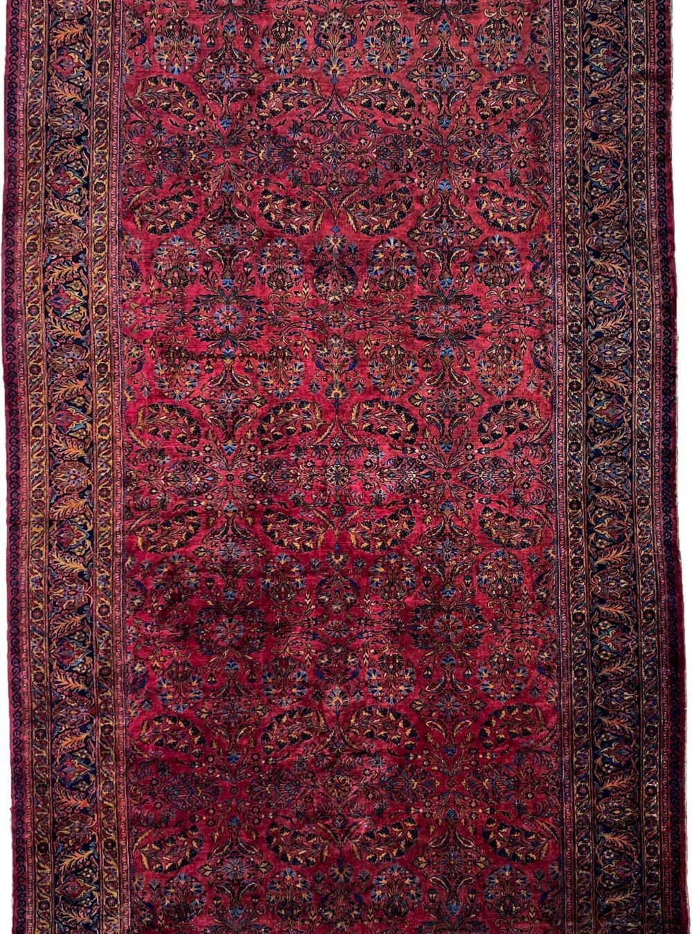 alt="Large Lilihan carpet with deep red field and blue floral border" alt="Rare oversized Persian rug with all-over bush design" alt="Naturally dyed Lilihan rug with soft wool and excellent pile" alt="Traditional Persian carpet in red and blue with floral motifs"