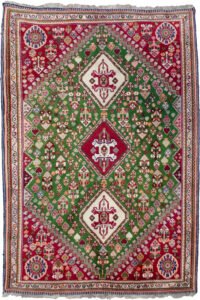 alt="Fine Qashqai rug with green field and three medallions" alt="Nomadic Persian rug with cypress motifs and red spandrels" alt="Tribal Qashqai rug with stylised bushes and narrow cream border" alt="Rare green ground Persian tribal rug from South Iran"