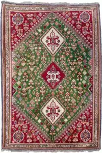 alt="Fine Qashqai rug with green field and three medallions" alt="Nomadic Persian rug with cypress motifs and red spandrels" alt="Tribal Qashqai rug with stylised bushes and narrow cream border" alt="Rare green ground Persian tribal rug from South Iran"