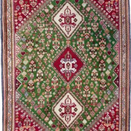 alt="Fine Qashqai rug with green field and three medallions" alt="Nomadic Persian rug with cypress motifs and red spandrels" alt="Tribal Qashqai rug with stylised bushes and narrow cream border" alt="Rare green ground Persian tribal rug from South Iran"