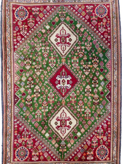 alt="Fine Qashqai rug with green field and three medallions" alt="Nomadic Persian rug with cypress motifs and red spandrels" alt="Tribal Qashqai rug with stylised bushes and narrow cream border" alt="Rare green ground Persian tribal rug from South Iran"