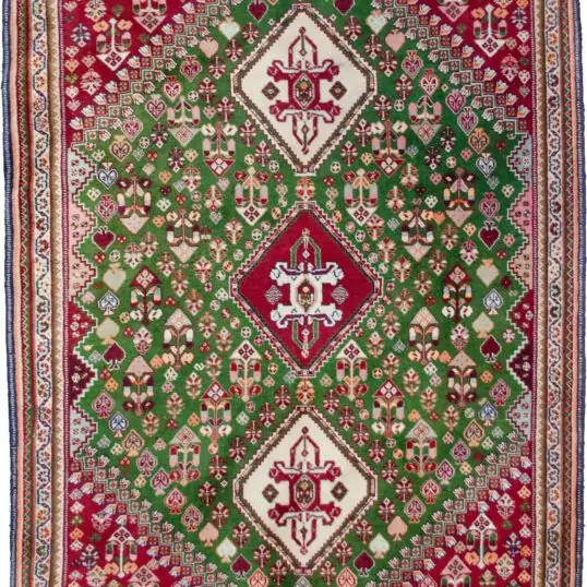 alt="Fine Qashqai rug with green field and three medallions" alt="Nomadic Persian rug with cypress motifs and red spandrels" alt="Tribal Qashqai rug with stylised bushes and narrow cream border" alt="Rare green ground Persian tribal rug from South Iran"