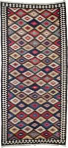 This rare and beautifully woven Saveh kilim is a testament to the exceptional quality and artistry that emerges from even the lesser-known weaving regions of Iran. While the city of Saveh and its surrounding villages are not major kilim production centres, the pieces that do originate from there are often outstanding in both design and craftsmanship—and this example is no exception. The kilim features a dazzling all-over lozenge design, bold and rhythmic, creating visual energy that draws the eye and enlivens any space. The field is framed by a soft cream border, which not only softens the dynamic central pattern but also elevates the overall composition with elegance and balance. Woven using traditional flatweave techniques and naturally dyed wool, this piece is lightweight yet durable, and easy to use in various interior settings—from rustic and eclectic to contemporary and minimalist. Kilims like this are often underrated, yet they represent a sophisticated blend of utility, tradition, and decorative appeal. This piece, in particular, stands out as an engaging and collectible work of woven art. ✅ Key Features: Origin: Saveh, Iran Type: Kilim (flatweave) Design: Dazzling lozenge pattern Border: Cream, with geometric motifs Material: Wool Dye: Natural vegetable dyes Condition: Excellent Size: (Insert dimensions if available) Use: Wall hanging, floor rug, layering textile, collector’s item ✅ Why This Kilim? Rare in origin and rich in style, this Saveh kilim brings colour, movement, and authentic craftsmanship to any interior—a true decorative gem. ✅ Call to Action Celebrate the art of flatweave with this vibrant Saveh kilim—a stylish and distinctive piece woven with heritage and flair.