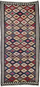 This rare and beautifully woven Saveh kilim is a testament to the exceptional quality and artistry that emerges from even the lesser-known weaving regions of Iran. While the city of Saveh and its surrounding villages are not major kilim production centres, the pieces that do originate from there are often outstanding in both design and craftsmanship—and this example is no exception. The kilim features a dazzling all-over lozenge design, bold and rhythmic, creating visual energy that draws the eye and enlivens any space. The field is framed by a soft cream border, which not only softens the dynamic central pattern but also elevates the overall composition with elegance and balance. Woven using traditional flatweave techniques and naturally dyed wool, this piece is lightweight yet durable, and easy to use in various interior settings—from rustic and eclectic to contemporary and minimalist. Kilims like this are often underrated, yet they represent a sophisticated blend of utility, tradition, and decorative appeal. This piece, in particular, stands out as an engaging and collectible work of woven art. ✅ Key Features: Origin: Saveh, Iran Type: Kilim (flatweave) Design: Dazzling lozenge pattern Border: Cream, with geometric motifs Material: Wool Dye: Natural vegetable dyes Condition: Excellent Size: (Insert dimensions if available) Use: Wall hanging, floor rug, layering textile, collector’s item ✅ Why This Kilim? Rare in origin and rich in style, this Saveh kilim brings colour, movement, and authentic craftsmanship to any interior—a true decorative gem. ✅ Call to Action Celebrate the art of flatweave with this vibrant Saveh kilim—a stylish and distinctive piece woven with heritage and flair.