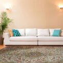Antique Persian rug in a neutral London living room with mid-century decor