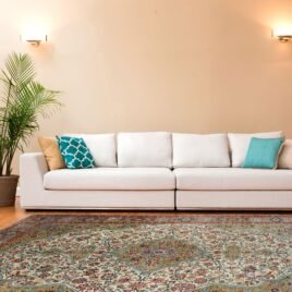 Antique Persian rug in a neutral London living room with mid-century decor
