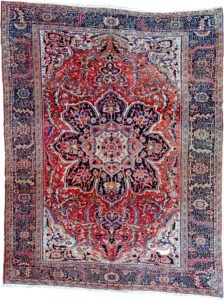 alt="Vintage Ahar Heriz carpet with red field and blue floral border" alt="Persian Heriz rug with central medallion and cream spandrels" alt="Northwest Iran rug with stylised floral design and bold medallion" alt="Traditional Heriz carpet from Ahar with red and blue color palette"